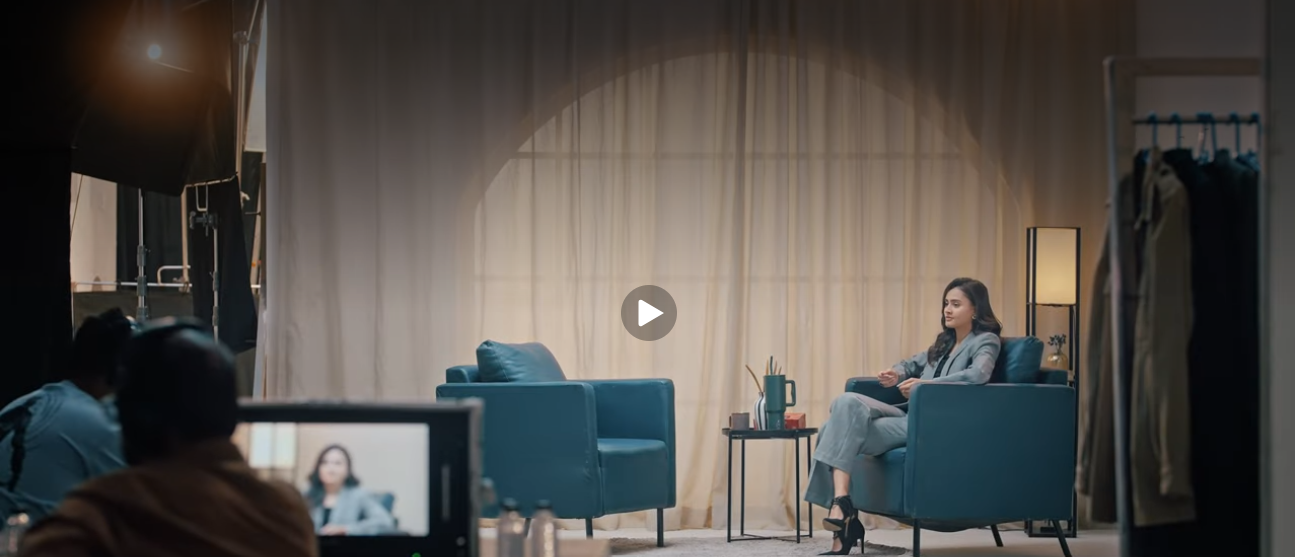 Digital video commercial production with a professional camera filming a staged advertising scene.